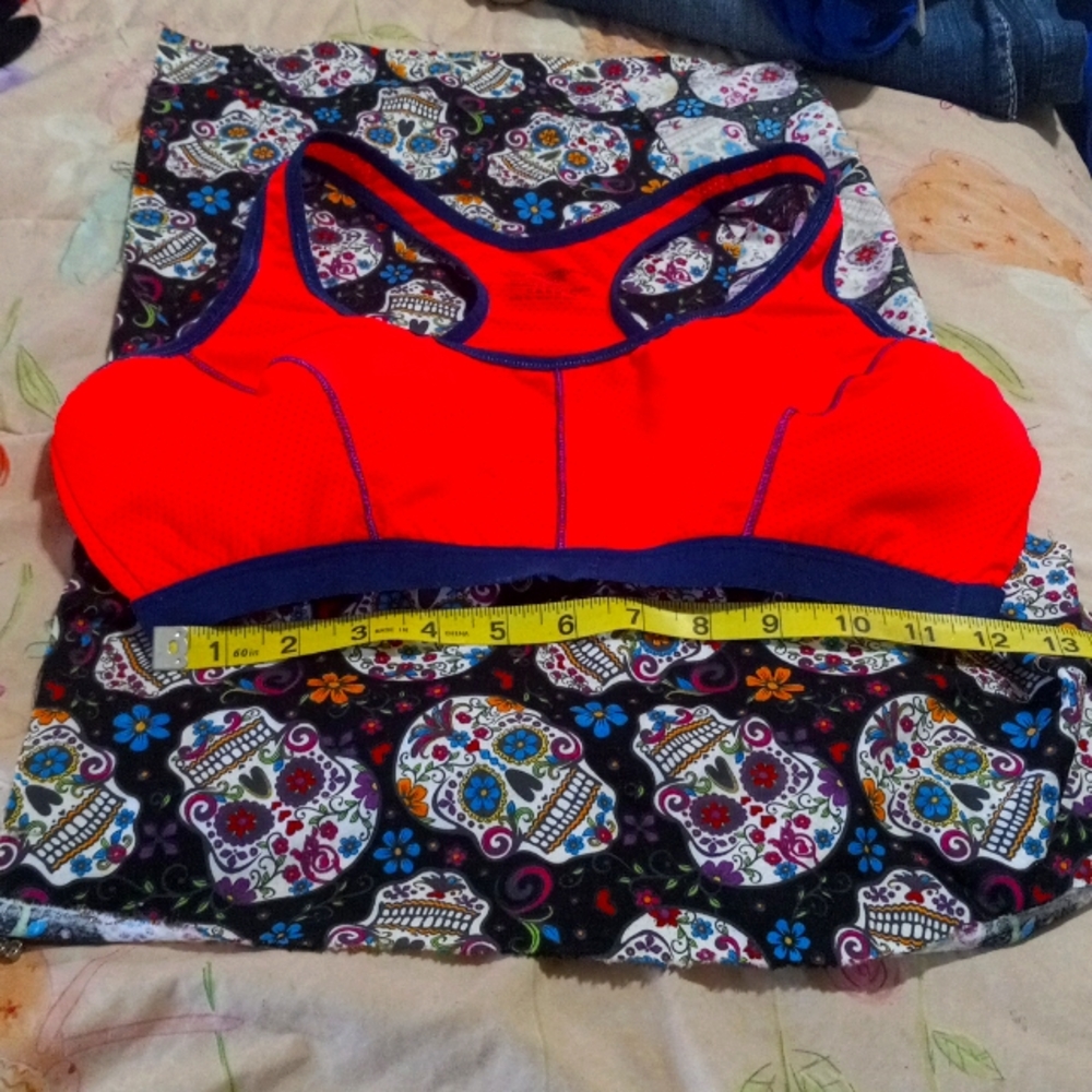 Danskin now hot- pink/blue sportsbra 24 to 32 inches around and like new.